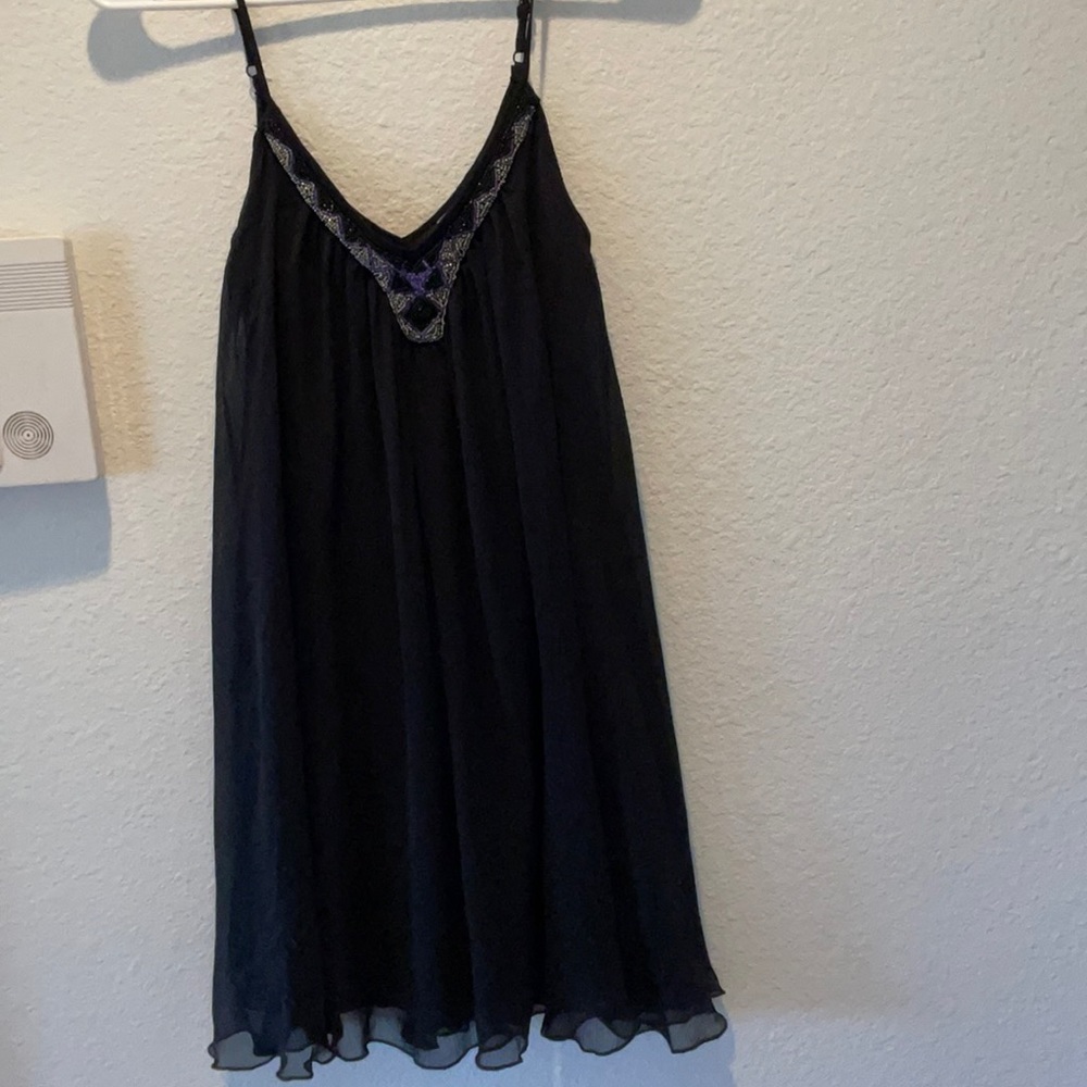 1 Black Express Dress with sequence across the chest